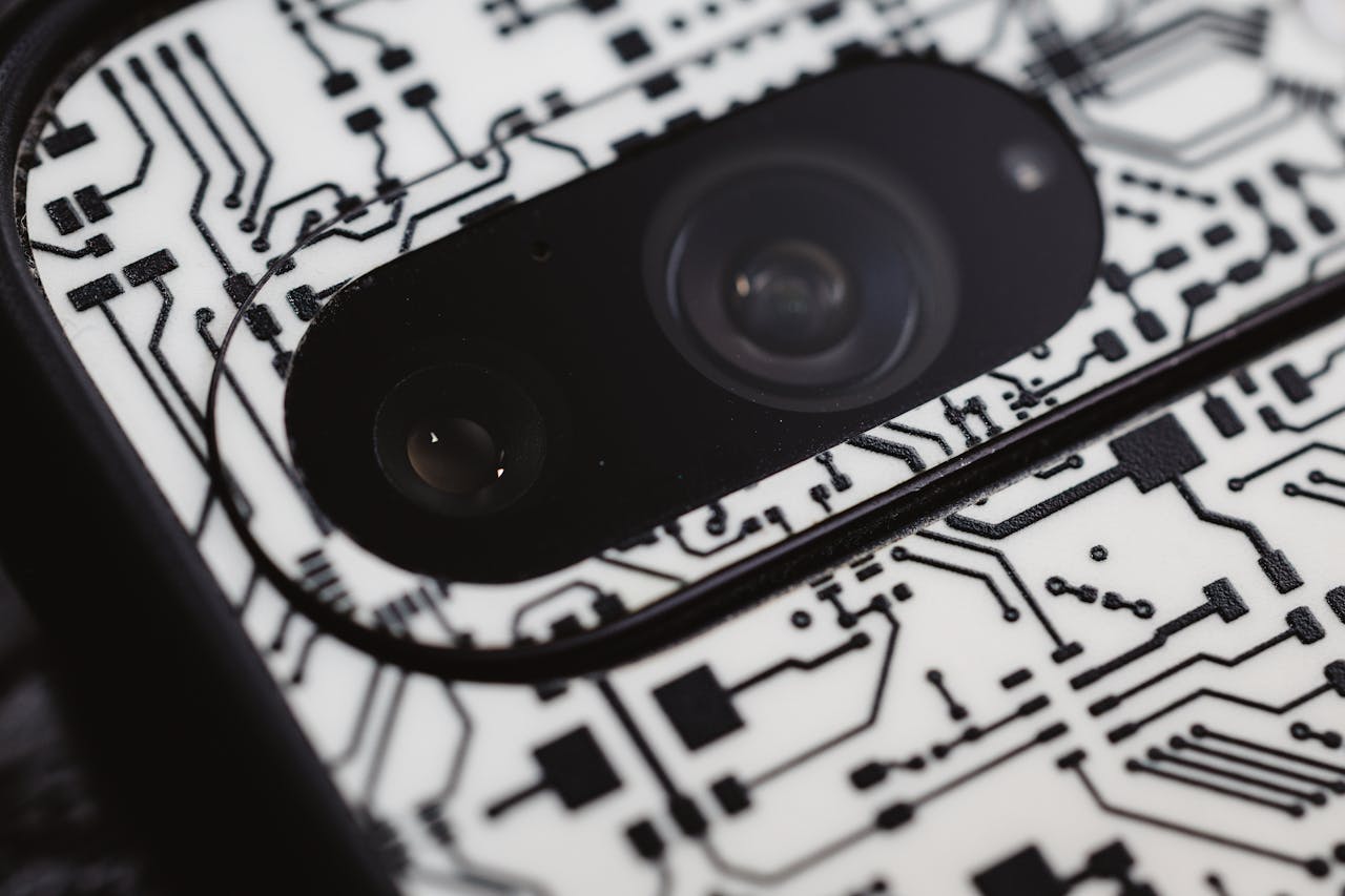 The Art of Drawing Readers In: Your attractive post title goes here Macro shot of an electronic circuit design around a smartphone camera lens, showing intricate details.