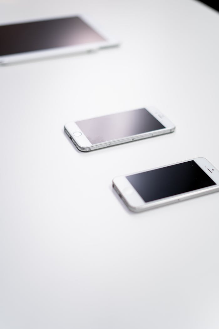 Mastering the First Impression: Your intriguing post title goes here Overhead view of digital devices on a white table - ideal for tech themes.
